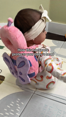 Baby wearing a soft head protector cushion while sitting and moving